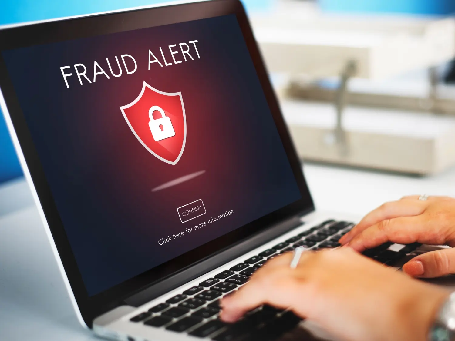 Fraud alert displayed on a laptop screen
